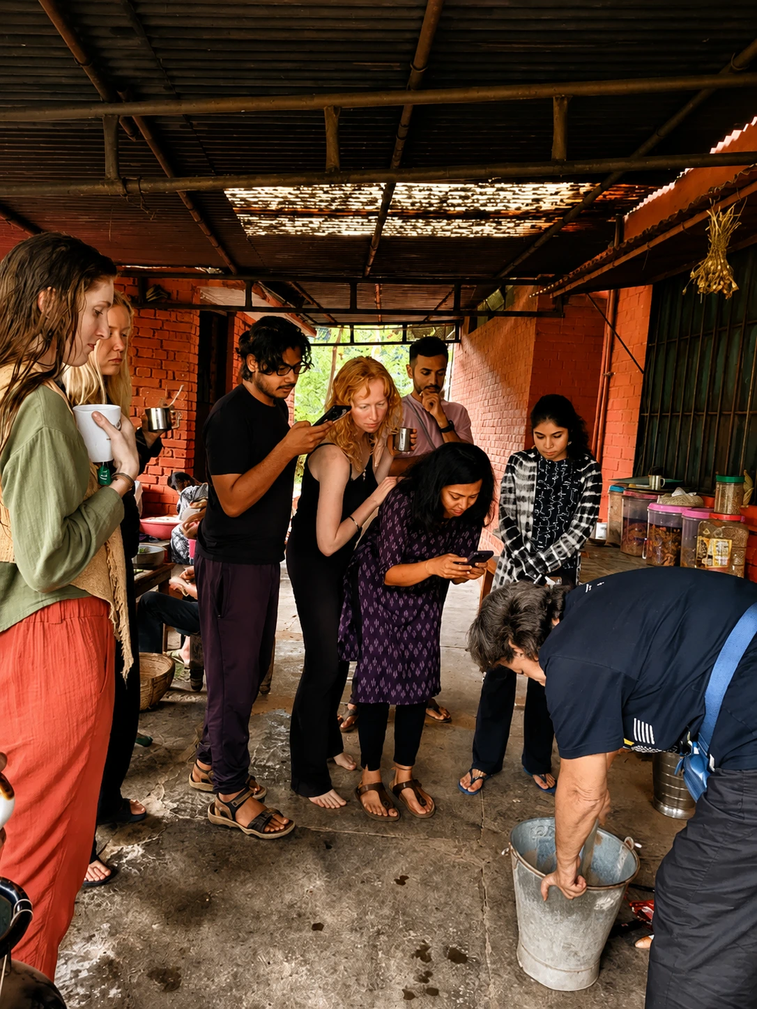 Participants learning a hands-on farm process together